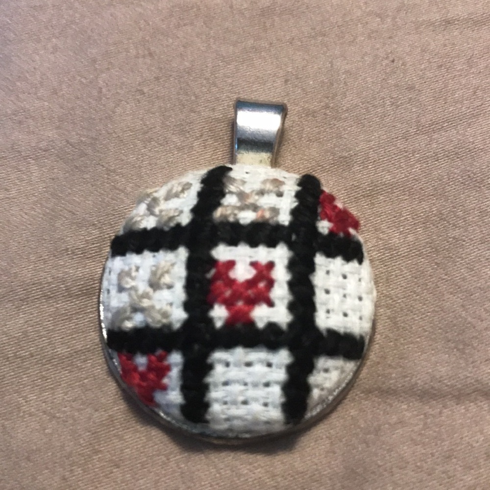Red and tan tic tax toe editioned charm
